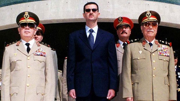 Vulnerable ... Syrian President Bashar al-Assad, centre.