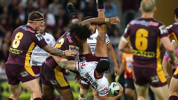 Big gamble ... The Broncos will today decide whether they will appeal Sam Thaiday's grade-two dangerous throw charge for this tackle on Brent Kite.