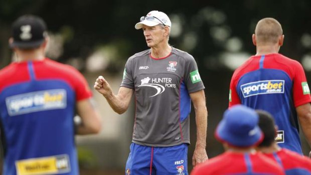 Funny side: Wayne Bennett lays down the law at training on Friday.