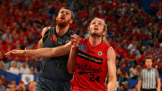 Perth Wildcat Jesse Wagstaff and Townsville's Brian Conklin battle at Perth Arena