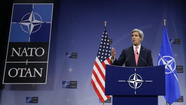 Members' club: US Secretary of State John Kerry speaks during a NATO foreign ministers' meeting. Australia may be on the verge of joining the organisation.