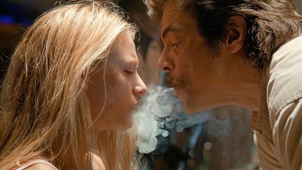 Blake Lively and Benicio Del Toro share a moment in Savages.