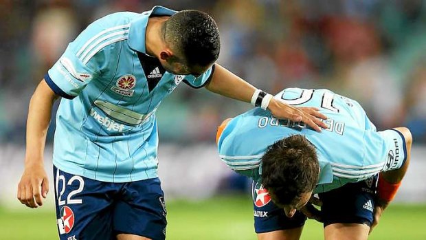 Out: Sydney FC skipper Alessandro Del Piero (right) clutches his hamstring before limping off against Newcastle on Friday night.