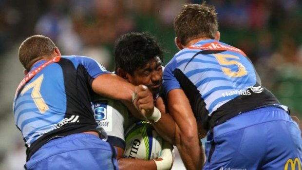 Will Skelton is crunched by the Force defence during the Waratahs' loss in Perth on Saturday night.