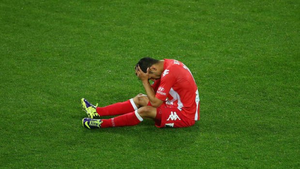 That losing feeling: Aziz Behich of the Heart reacts after the final whistle.