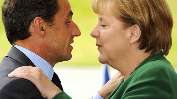 French President Nicolas Sarkozy and German Chancellor Angela Merkel head into key Greek bailout negotiations.