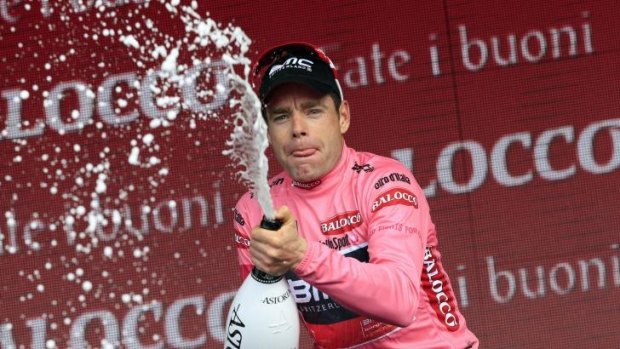 Cadel Evans celebrates the pink jersey of the overall leader on the podium of the 9th stage of the 97th Giro d'Italia in May.