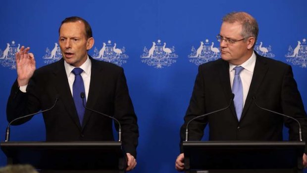 Asylum seekers paid off: Prime Minister Tony Abbott and Immigration Minister Scott Morrison.