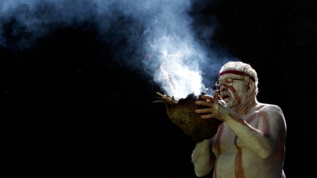 Repatriation: Elder Bryon Powell prepares for  the traditional smoking ceremony.