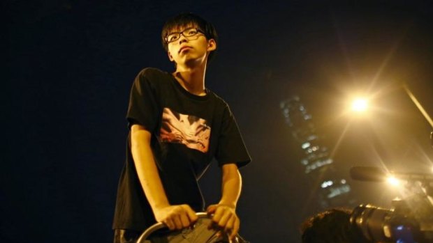 Joshua Wong, leader of the student movement take a pause after delivering a speech to protesters outside of offices of Hong Kong's Chief Executive, Leung Chun-ying.