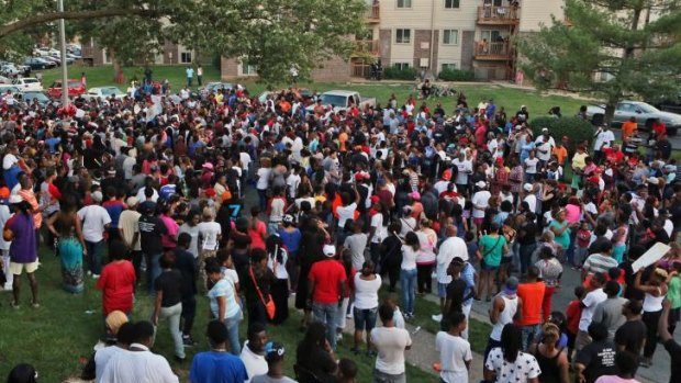 A large crowd gathers at the candlelight vigil for18-year-old Michael Brown on Sunday evening in Ferguson, Missouri.
