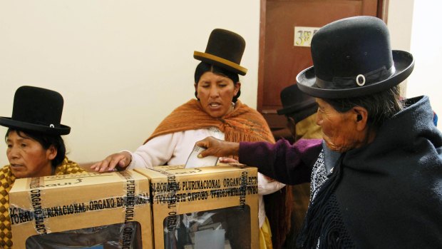 Ballots for change ...  an indigenous woman casts her vote during the presidential elections which returned the President, Evo Morales. Much of his support came from Bolivia’s indigenous majority.