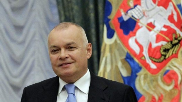 Russian television journalist Dmitry Kiselyov posing for a photo after receiving a medal of Friendship  during an awarding ceremony in the Kremlin in Moscow. 