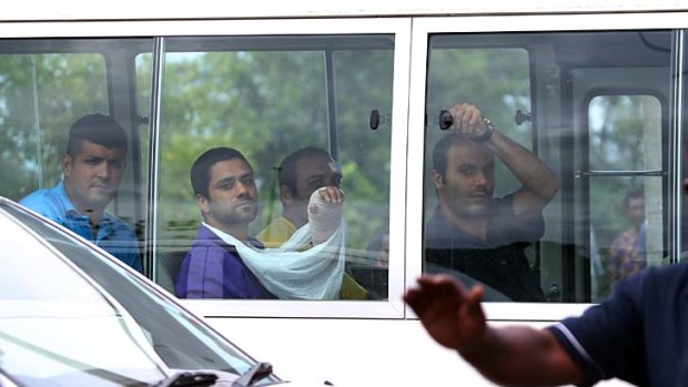 Injured asylum seekers arrive at the hospital on Manus Island.