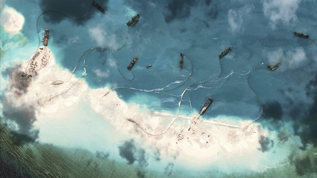 A satellite image supplied by the US-based Centre for Strategic and International Studies shows Chinese dredgers working at the northernmost reclamation site of Mischief Reef, part of the Spratly Islands, in the South China Sea, on March 17.