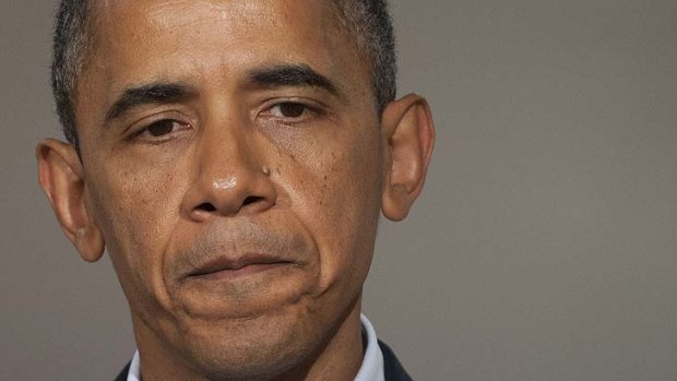 Barack Obama says he has hugged and "shed tears" with survivors of the Colorado shooting and relatives of the dead, saying the entire country is "thinking about them".