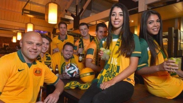 Looking forward: Socceroos fans meet in a Melbourne restaurant to plan their trip.