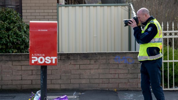 Police investigate the death of cyclist Peter McGuffie in West Footscray on Thursday.