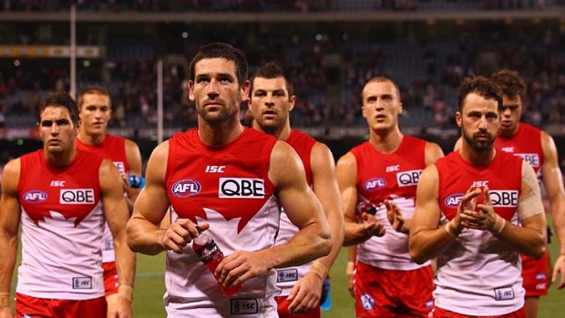 The Sydney Swans leave the ground after the game.
