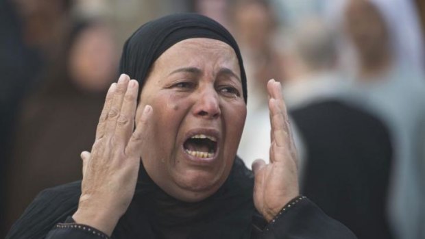 An Egyptian woman outside court in Minya after 683 alleged Islamists were sentenced to death.