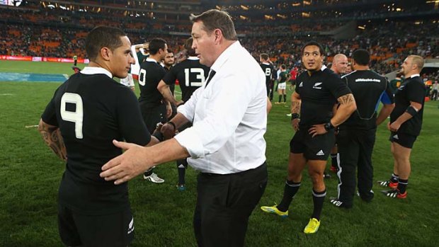 Steve Hansen congratulates scrum-half Aaron Smith after the All Blacks completed a 32-16 victory over South Africa.