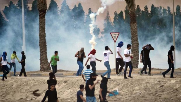 Unrest ... tear gas is used after conflict breaks out in a Bahrain village.