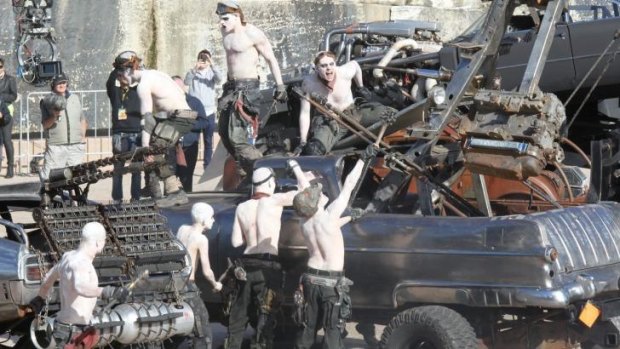 It's lunchtime: War Boys scramble over vehicles at the <i>Mad Max: Fury Road</i> show at Sydney Opera House.