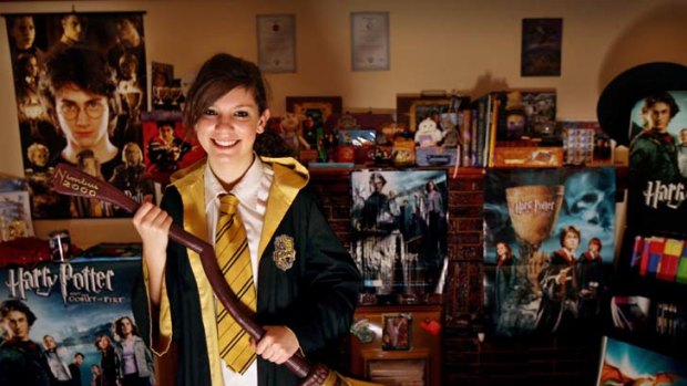 Broom to move ... Erica Crombie, a fan since she was nine, with her collection of Harry Potter memorabilia.