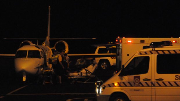 One of the first asylum seekers to be taken off a plane at Darwin Airport.