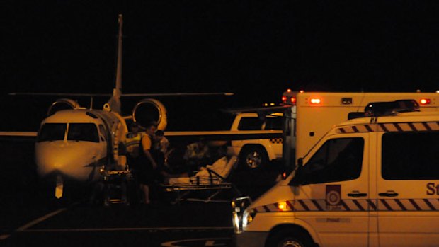 One of the first asylum seekers to be taken off a plane at Darwin Airport.