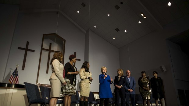 Joined by victims of gun violence, Hillary Clinton speaks at the Central Baptist Church in Columbia, South Carolina, in February. 