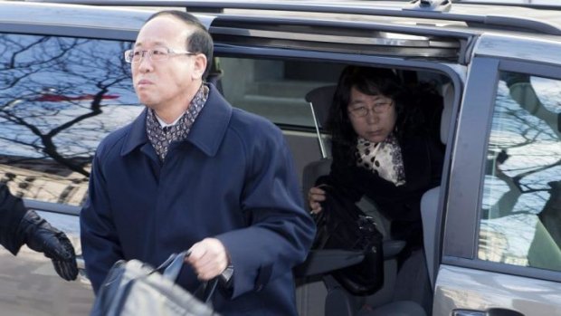 Liu Qian's father Liu Jianhui and mother Zheng Yaru,  arrive at court for the trial of Brian Dickson.