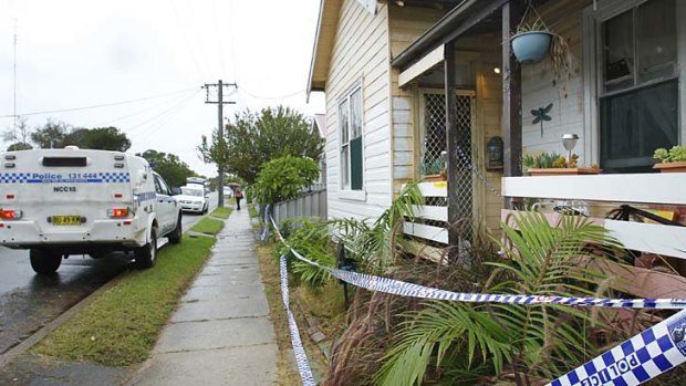 Murder mystery: police cordoned off Anthony O'Grady's home.