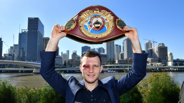 Jeff Horn proudly displays his WBO welterweight champion’s belt in Brisbane after beating Manny Pacquiao.