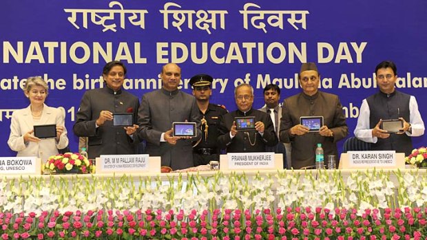 Indian officialls show off the new Aakash 2 tablet at National Education Day.