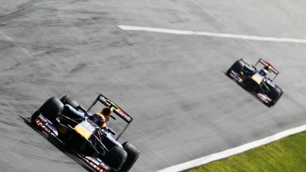 Mark Webber, who finished sixth, leads Red Bull teammate Sebastian Vettel. who finished fourth, in the Italian Grand Prix.