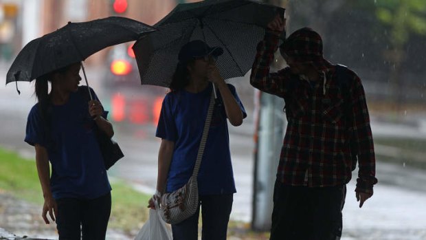 Staying dry ... torrential rain hit Sydney on Monday.