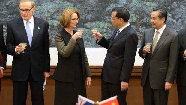 Prime Minister Julia Gillard shares a toast with Chinese Premier Li Keqiang during a signing ceremony at the Great Hall of the People in Beijing on April 9.