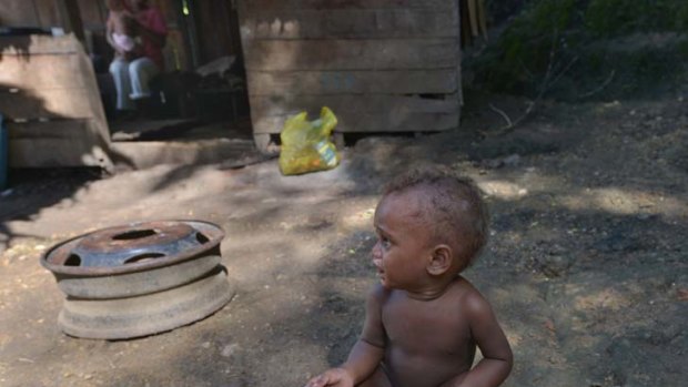 Outbreak of violence ... Junior, 2, lives in Koa Hill, an impoverished settlement in the Solomon Islands, that was the scene for revenge arson attacks.