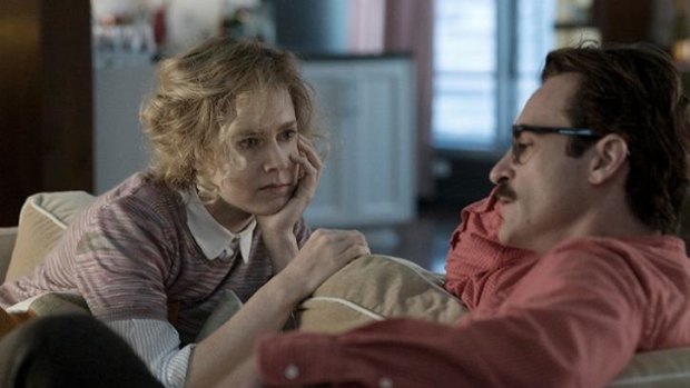 Amy Adams as Amy and Joaquin Phoenix as Theodore in the romantic <i>drama Her</i>.