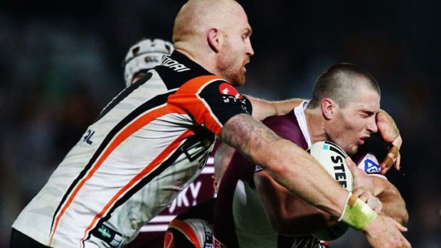 Under investigation ... Kieran Foran of the Sea Eagles is tackled by Keith Galloway of the Tigers on Friday night.