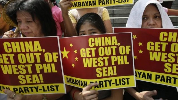Protesters picket the Chinese consulate in Manila to protest the use of water cannon by the Chinese coast guard to drive Filipino fishermen off disputed islands in the South China Sea.