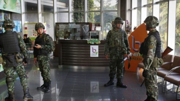 Soldiers in the foyer of the National Broadcasting Services of Thailand television station.