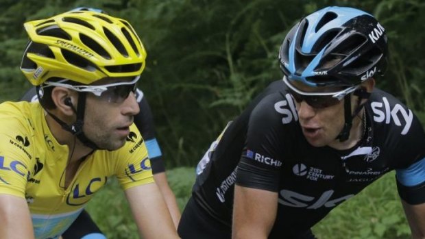 The leader chats to the challenger ... Italy's Vincenzo Nibali, wearing the overall leader's yellow jersey, and Australia's Richie Porte, right, talk as they ride in the pack during the ninth stage.