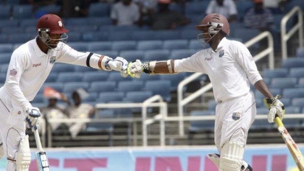 Denesh Ramdin, left, and Shivnarine Chanderpaul try to hold the West Indies innings together.