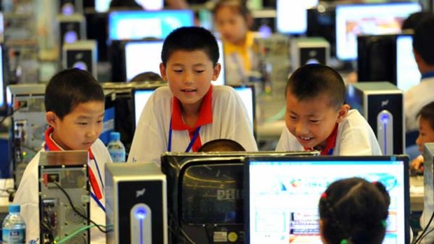Chinese children attend a computer class to learn how to properly use the Internet, in Beijing.