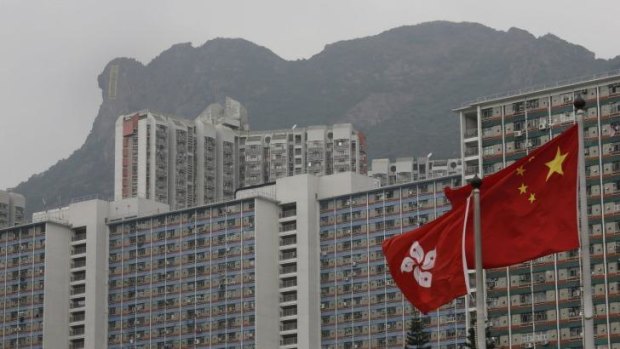 The protest banner is unfurled from the face of Lion Rock in Hong Kong. 