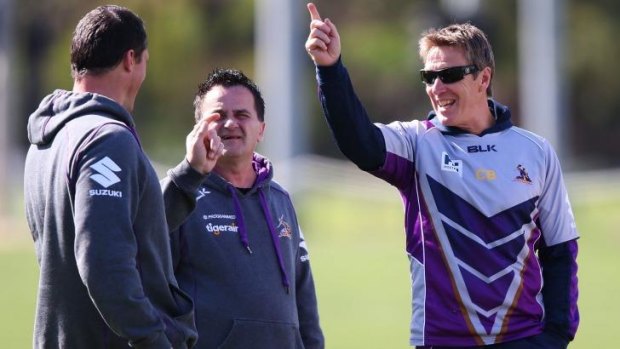 Coach Craig Bellamy (right) makes a point during a Storm training session in Melbourne on Friday.