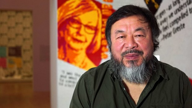 Ai Weiwei in the "Letgo Room" of portraits of Australian human rights champions. When LEGO refused the gallery's order, other toy bricks were substituted.