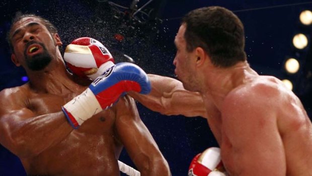Vladimir Klitschko lands one against British WBA champion David Haye in 2011.